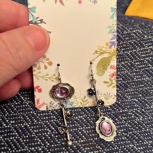 Silver tone and purple earrings